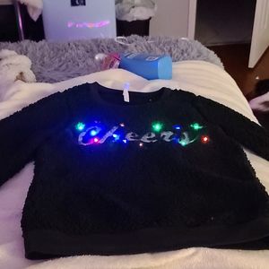 Black fluffy Christmas jacket.